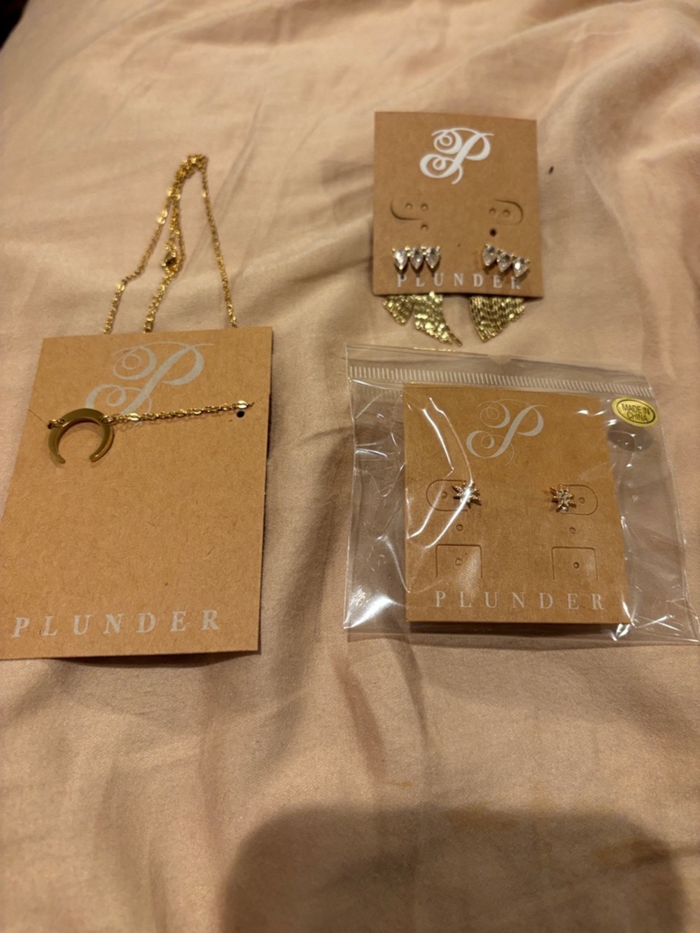 Plunder NWT jewelry bundle. 1 crescent moon necklace, and 2 pairs of earrings